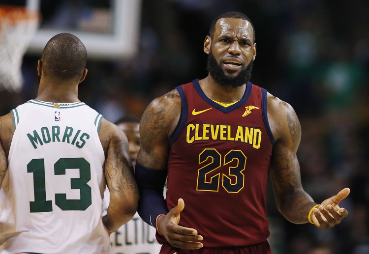 Cleveland Cavaliers forward LeBron James (23) reacts next to Boston Celtics forward Marcus Morris (13) during the third quarter of Game 1 of the NBA basketball Eastern Conference Finals, Sunday, May 13, 2018, in Boston. (AP Photo/Michael Dwyer)