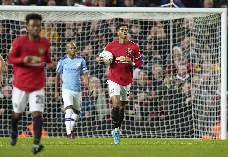 Marcus Rashford scores Manchester United's first goal against Man City during their EFL Cup semi-final clash